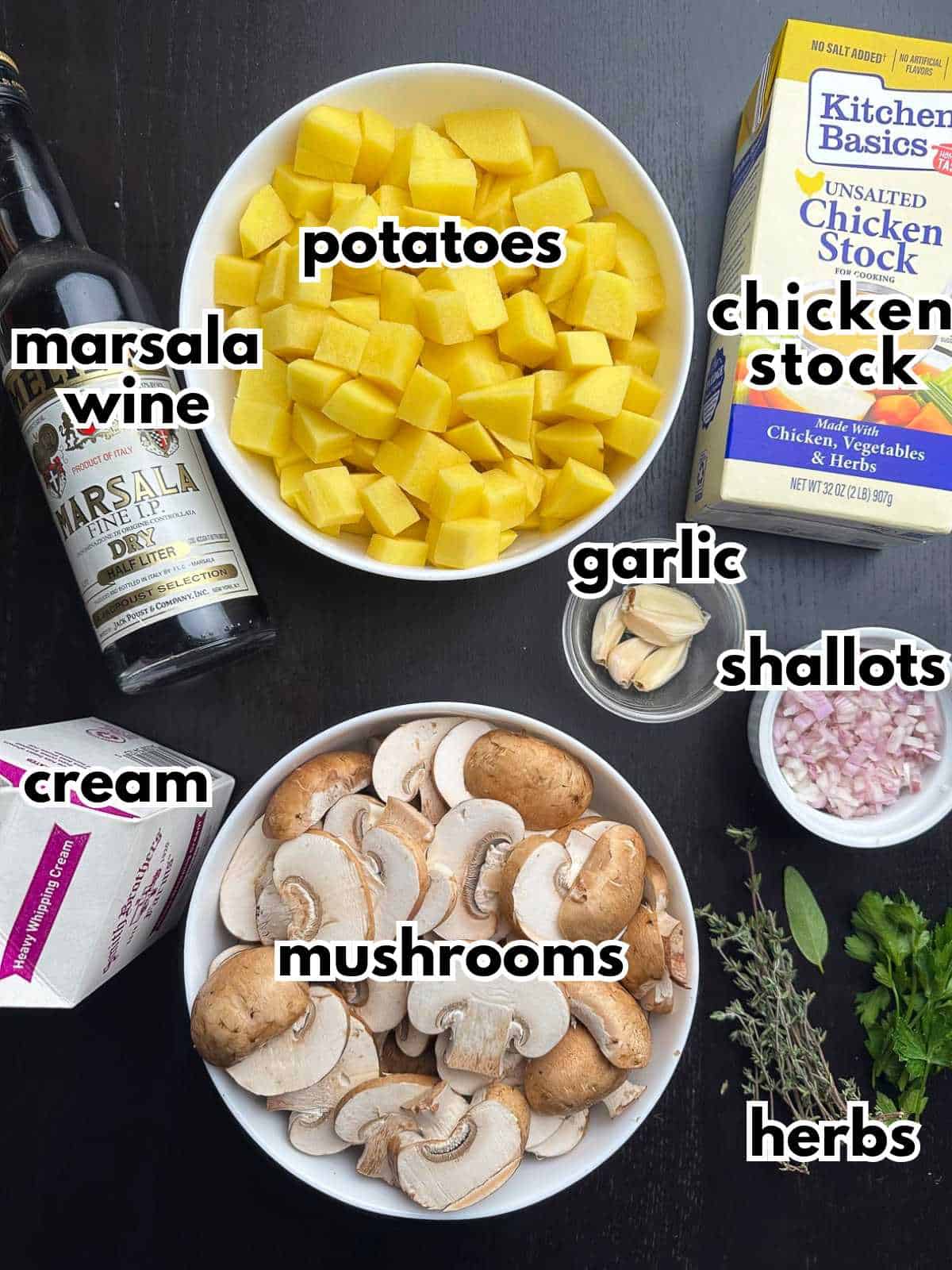 Ingredients laid out on a table for creamy mushroom and potato soup.