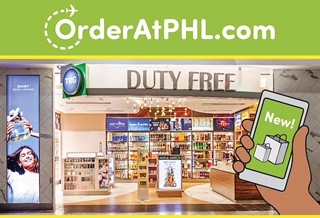 Duty-free shop with various products and a digital screen at the airport.