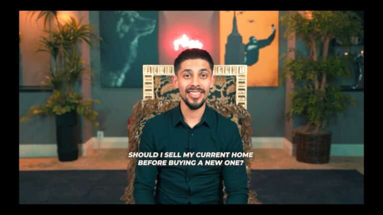 Modern man sitting in stylish home office with artwork and plants in Edmonton, Alberta.