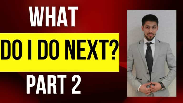 Young man in gray suit with black tie on modern background, professional realtor in Edmonton, Alberta.