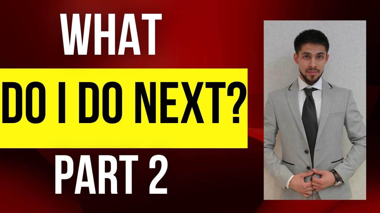 Young man in gray suit with black tie on modern background, professional realtor in Edmonton, Alberta.