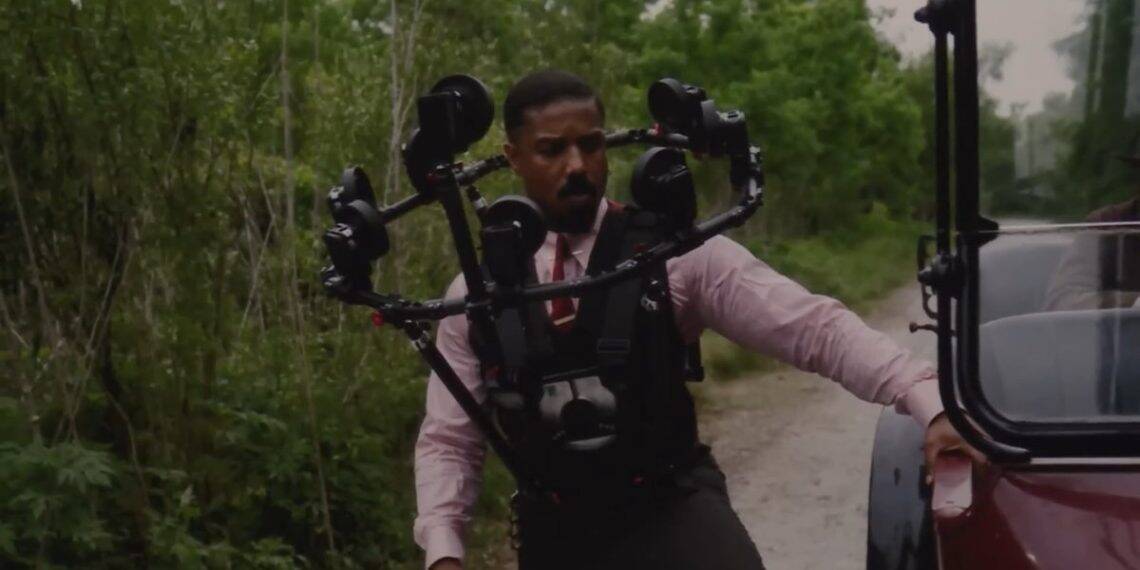 Warner Bros. Pictures reveals how twin scenes in Sinners were filmed using the innovative Halo Rig—featuring 10–12 cameras to capture Michael B. Jordan’s face and map it onto a stunt double in 50% of twin appearances.