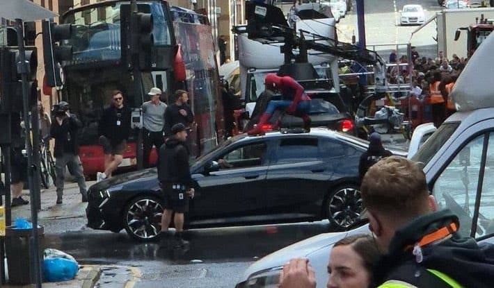 A scene of Spider-Man on Top of a car is about to be filmed.