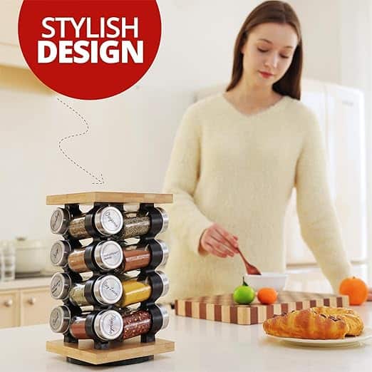 Color coded spice storage rack with glass jars in a modern kitchen featuring a young woman preparing food stylish and functional design
