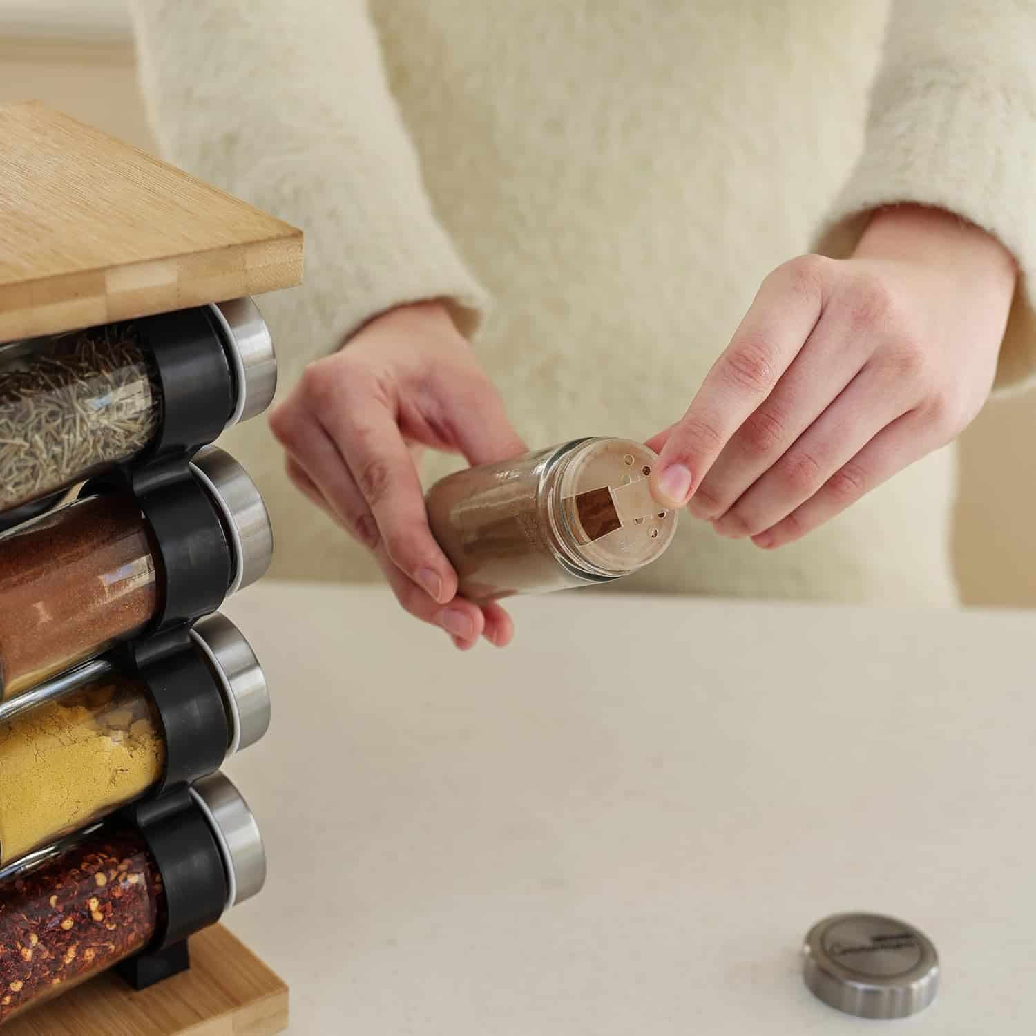 Pre measured spice jars for meal prep featuring a wooden spice rack in a modern kitchen Everything is organized for quick and healthy meal preparation at home