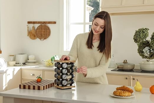 Healthy woman preparing meals in a bright kitchen with a spice rack and fresh ingredients for Meals in Motion nutritious meal programs