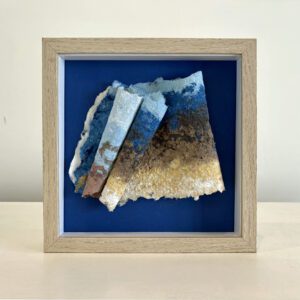 SOLD. Beach combing, blue mat, maple shadow box frame, 9 x 9 x 2 inches