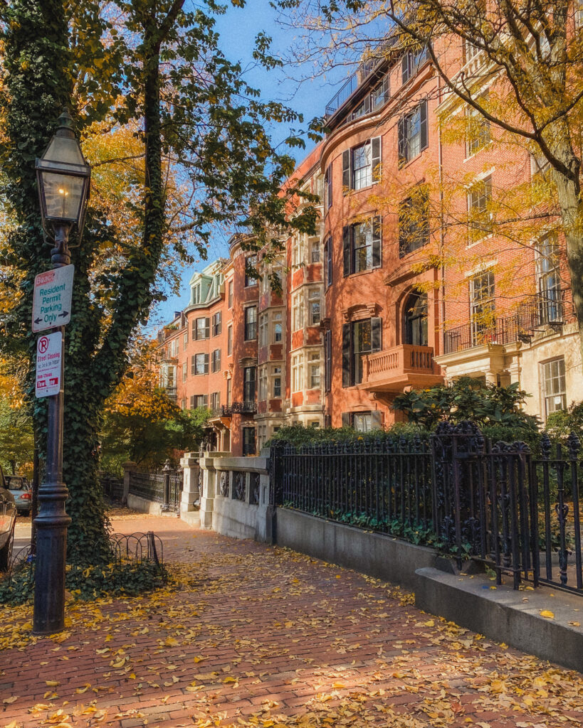 Here is an iconic row of brownstones in Beacon Hill adorned with fall foliage. The Beacon Hill neighborhood also has old fashioned black gas lamps.