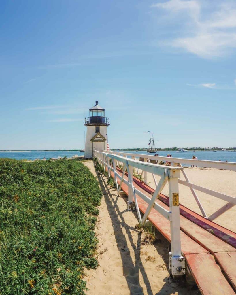 Brant Point Lighthouse is a relatively small lighthouse with its iconic white foot bridge leading up to it. Brant Point Lighthouse is not far from downtown Nantucket, and situated on a beach with plenty of sand wild grasses and even flowers. It also has views of the Nantucket harbor. You can watch all the different types of boats going in and out of the harbor from here.