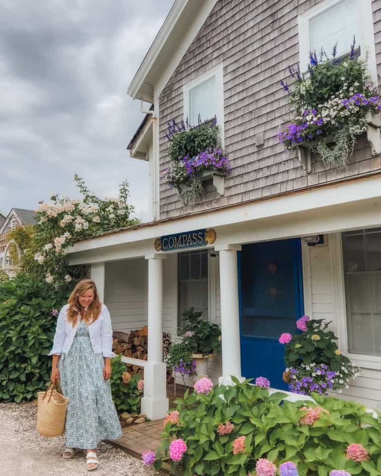 This beautiful gray shingled house adorned with a blue door and hydrangea flower pots is one of the many idyllic houses you'll find in the storybook village of Sconset on Nantucket. If I had to choose architecture on Nantucket vs Martha's Vineyard I would choose Nantucket. Much of the island is designated as a historical landmark!