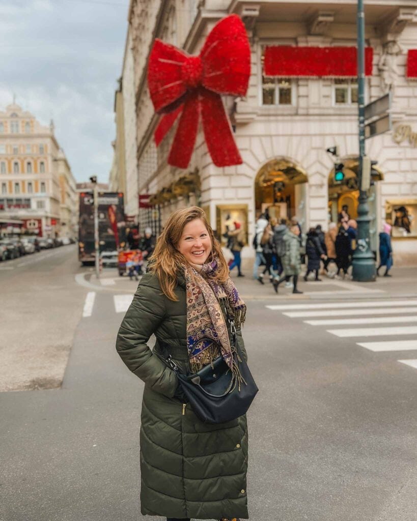 This famous red bow Christmas decoration in Vienna adorns the luxury fashion store Popp & Kretschmer on Kärntner Straße 51. This is one of the most instagrammable places in Vienna during the holidays, and the bow is even illuminated at night. 