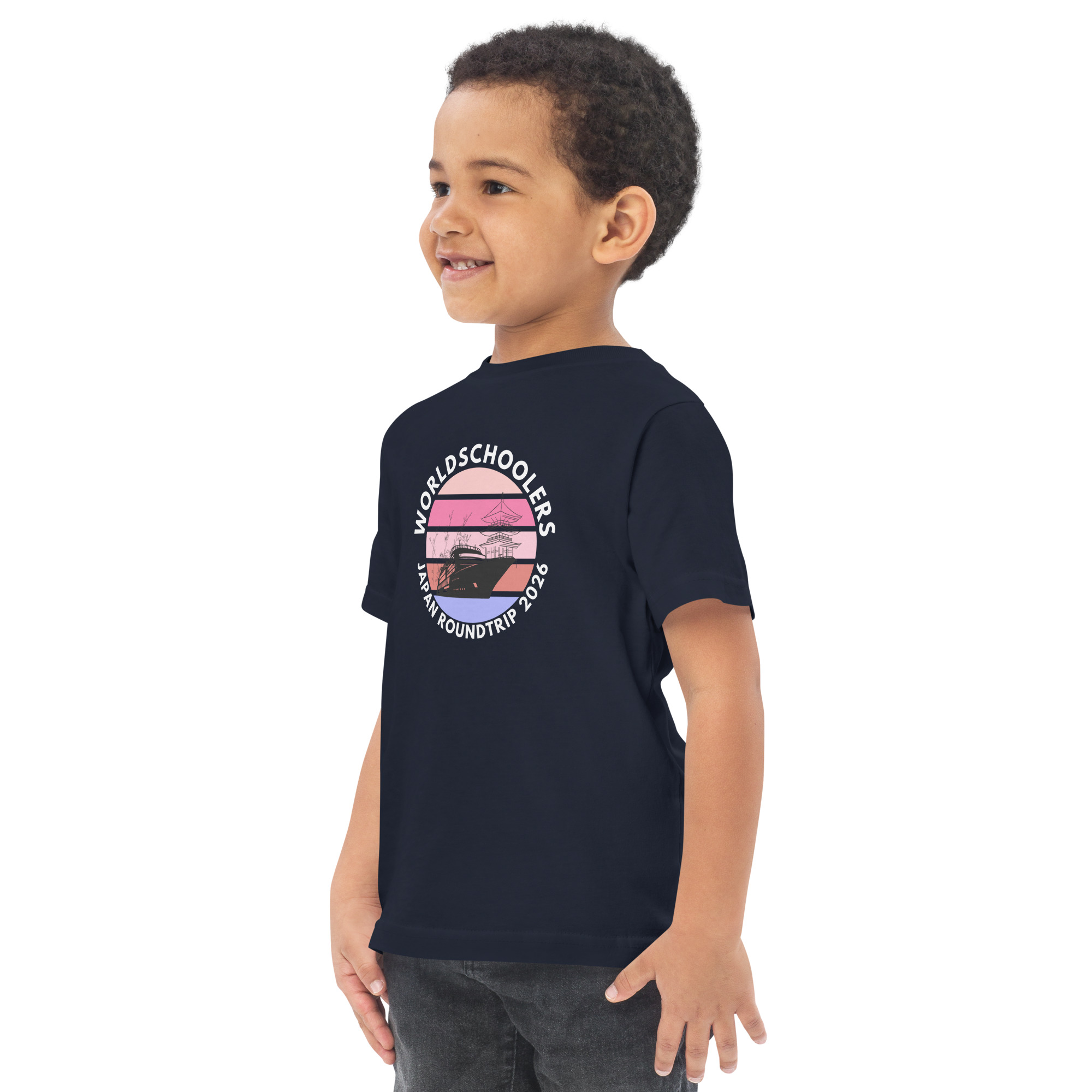 Toddler boy wearing a navy jersey T-shirt with a Japan Roundtrip 2026 graphic design, perfect for travel-themed casual wear.