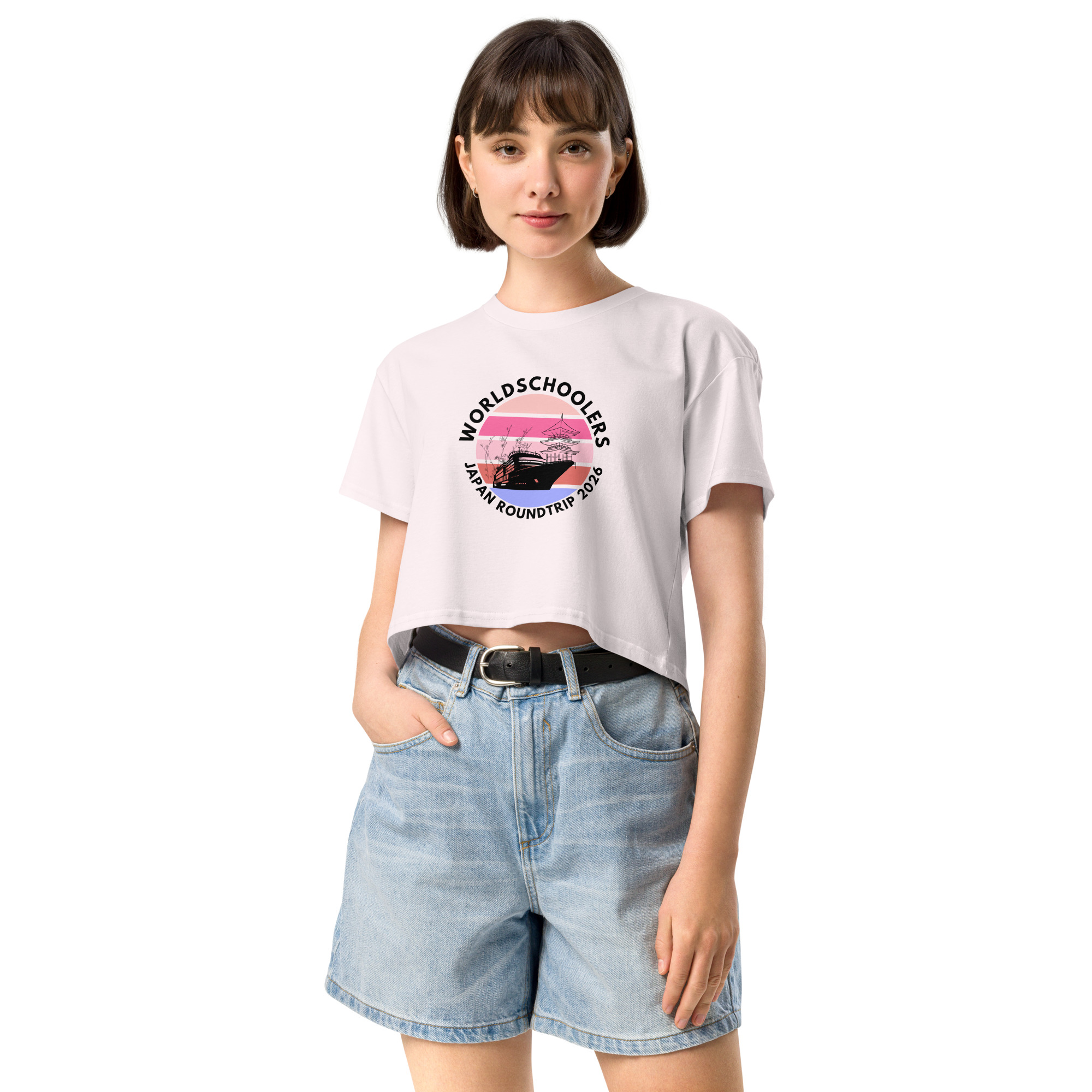 Women's crop top featuring a Japan roundtrip graphic with pink sunset, mountains, and text, perfect for travel and casual fashion enthusiasts.