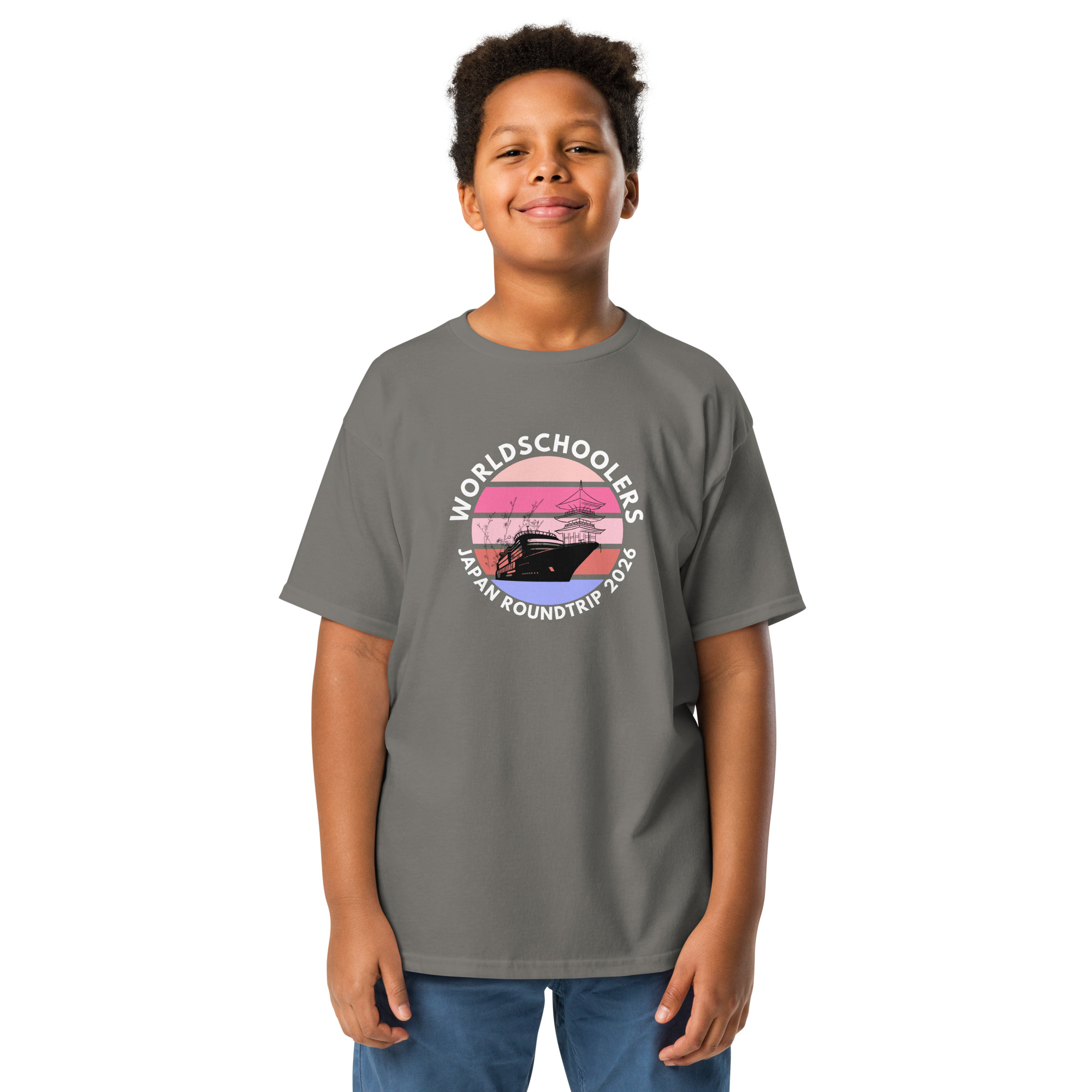 Child wearing a gray Japan Roundtrip 2026 youth graphic tee with a scenic sunset design, perfect for travel-themed fashion and youth casual wear.