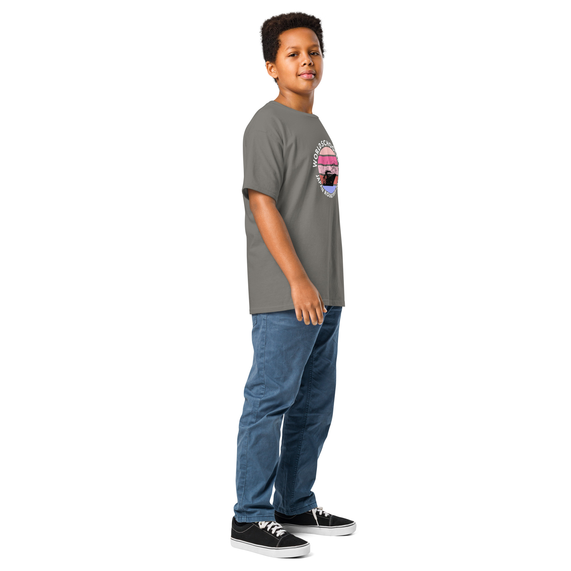 Child wearing a gray Melody Lane graphic tee with a colorful design, standing confidently. Perfect for kids who love stylish, comfortable graphic tees inspired by travel and adventure themes.