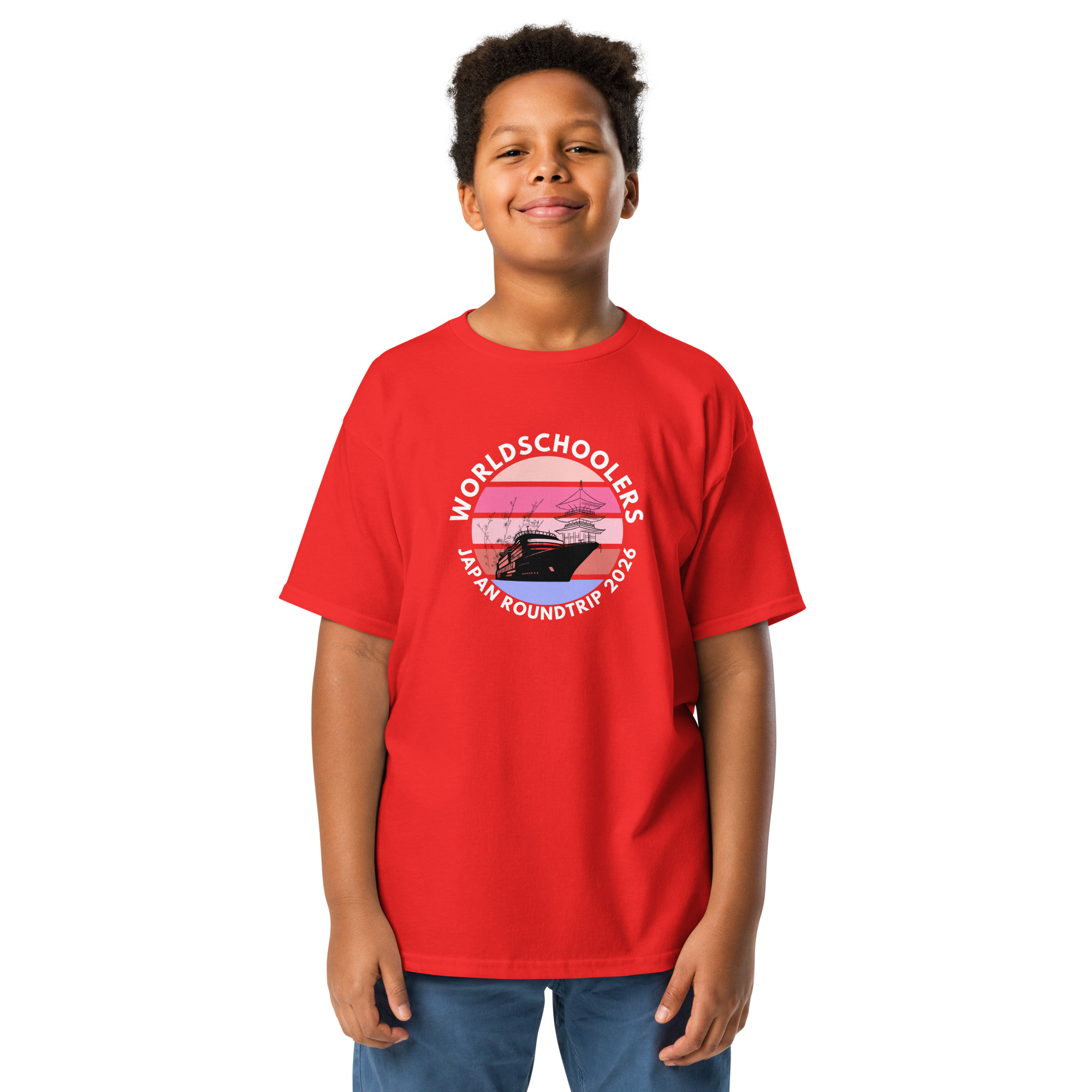 Child wearing a red youth graphic tee with Japan Roundtrip 2026 design, perfect for travel-themed fashion and casual wear.