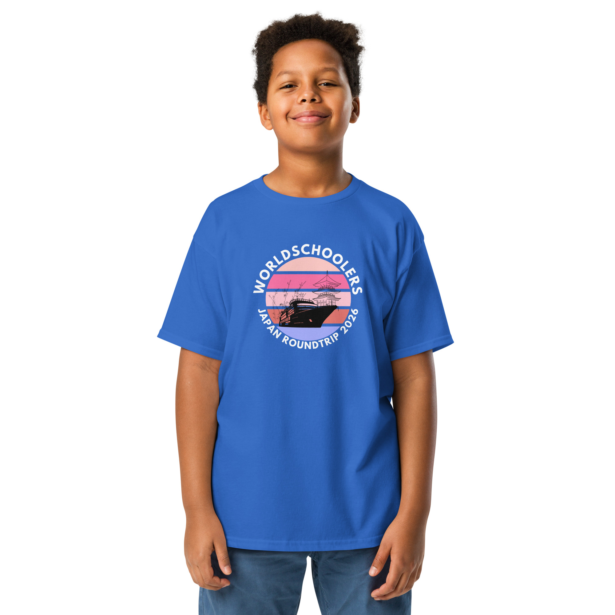 Child wearing a blue Japan Roundtrip 2026 youth graphic tee with a scenic design, perfect for travel-themed fashion and casual wear.