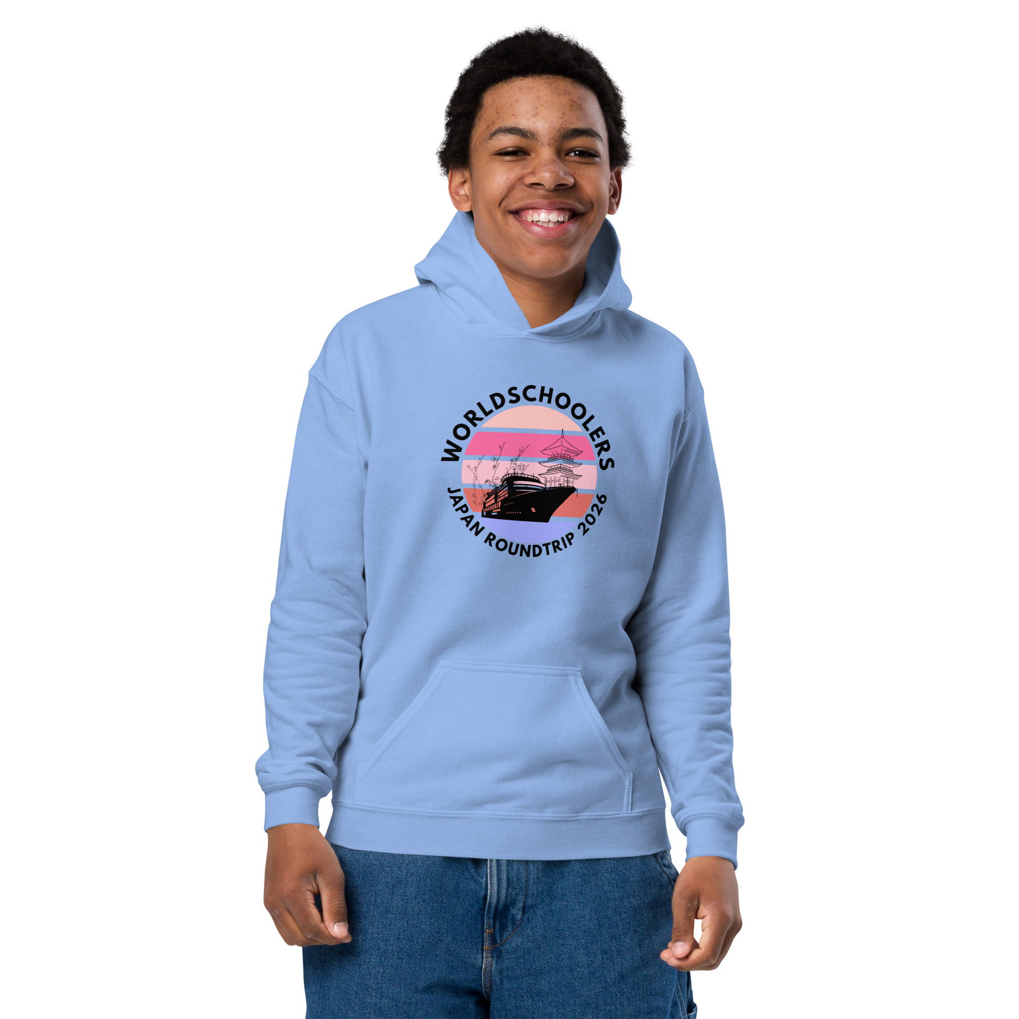 Youth wearing a light blue hoodie with "World Schools Japan Roundtrip 2026" logo, promoting travel and cultural exchange.