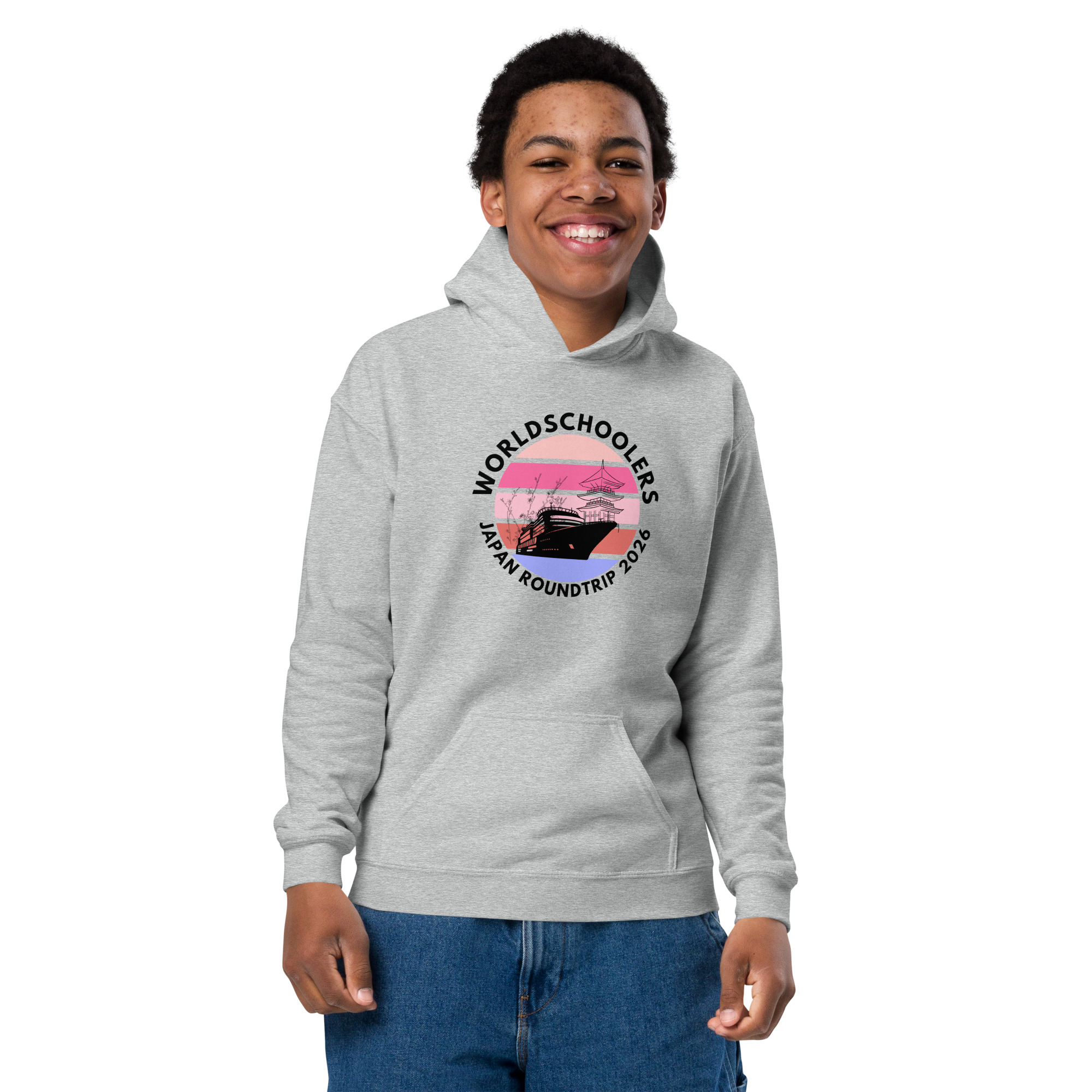 Youth wearing a light gray hoodie with a Japan roundtrip 2026 graphic, perfect for travel enthusiasts and students. Comfortable, stylish, and ideal for casual wear.