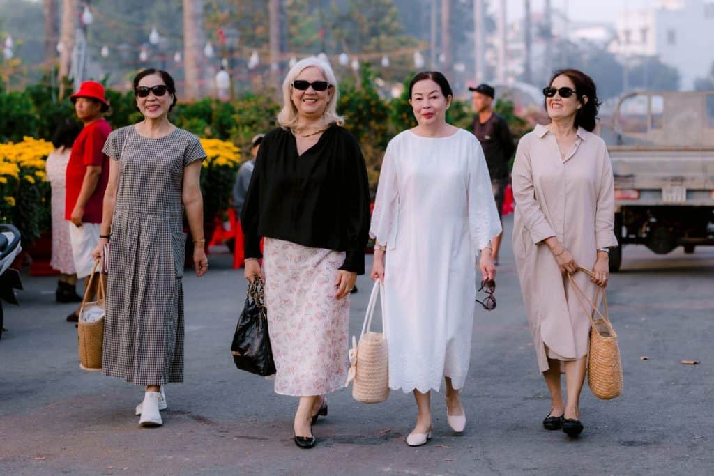 Women walking together outdoors, smiling