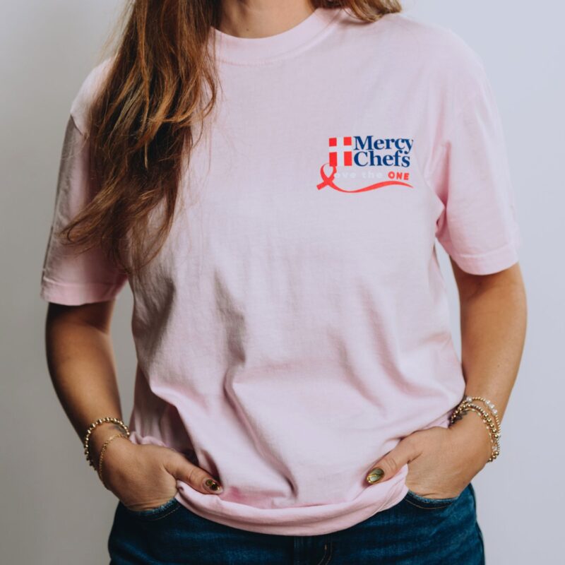 A front view of Mercy Chefs' "Love the One" t-shirt