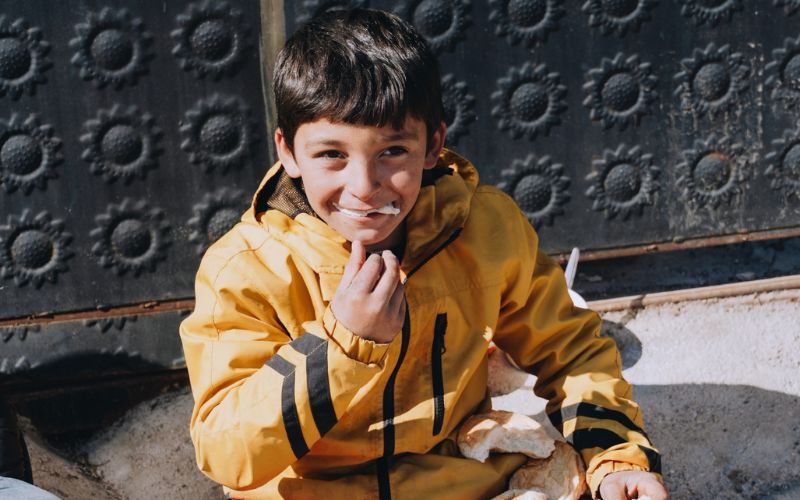 A boy enjoying a hot meal in Turkey after the devastating earthquakes