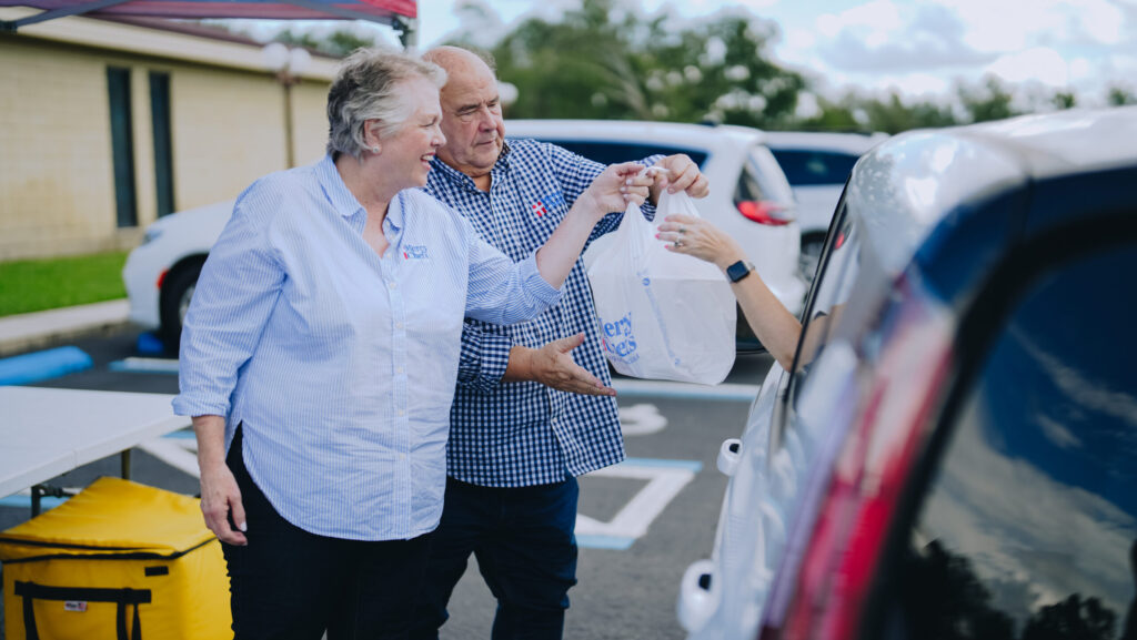 Chef Gary and Ann LeBlanc distributing hot meals to those affected by Hurricane Francine in Live Oak, FL.