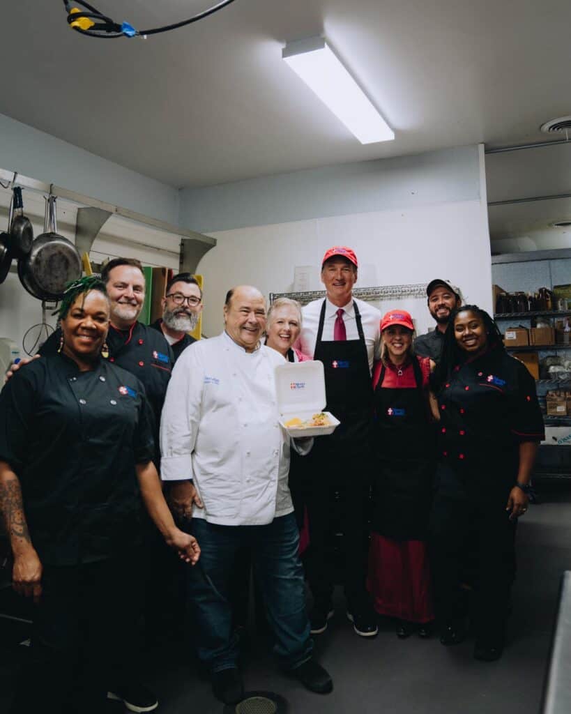 Governor Glenn Youngkin and First Lady Suzanne Youngkin preparing meals with the Mercy Chefs team.