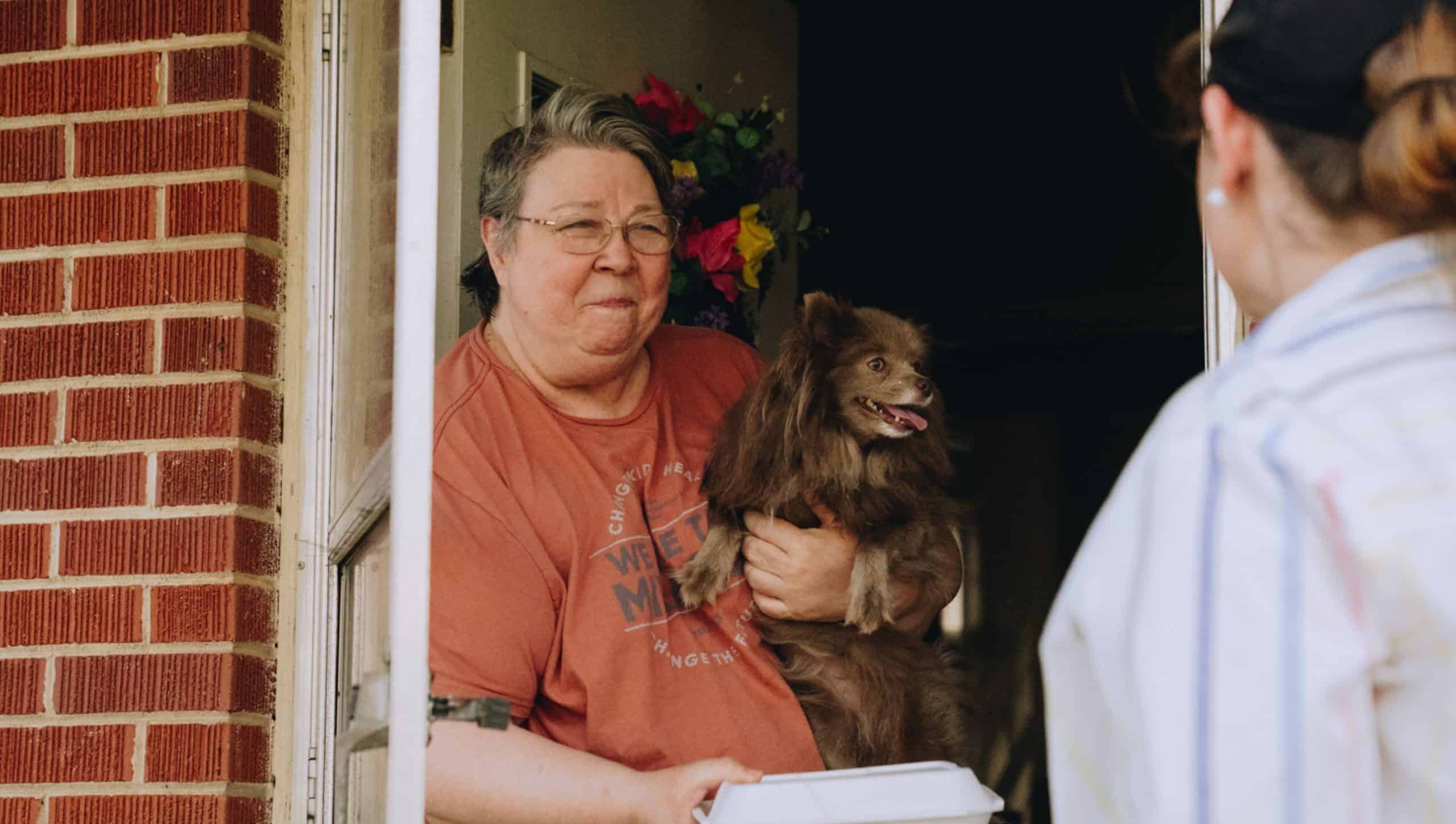 Tornado victim receiving a Mercy Chefs meal in Selmer, TN.