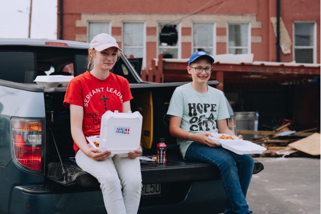 Children receiving hot meals in the aftermath of the tornado in St. Louis, MO