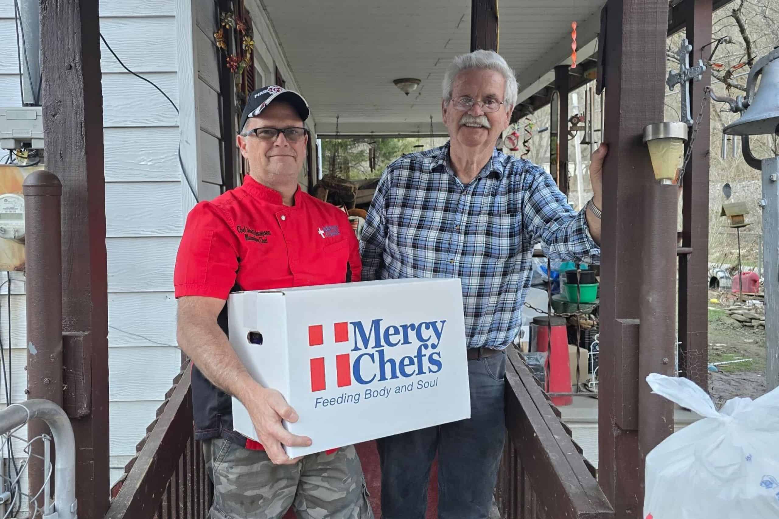Chef John delivering a grocery box to a flood victim in Kentucky