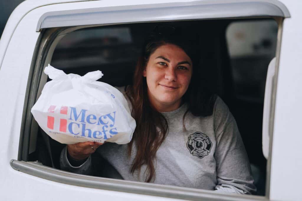 A flood victim receiving a Mercy Chefs meal in Kerr County, TX