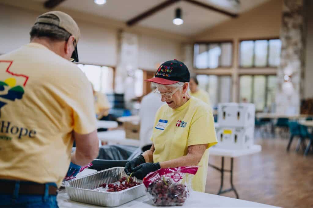 Volunteers prepare meals at Mercy Chefs' Beacon of Hope Kitchen in Kerrville, Texas