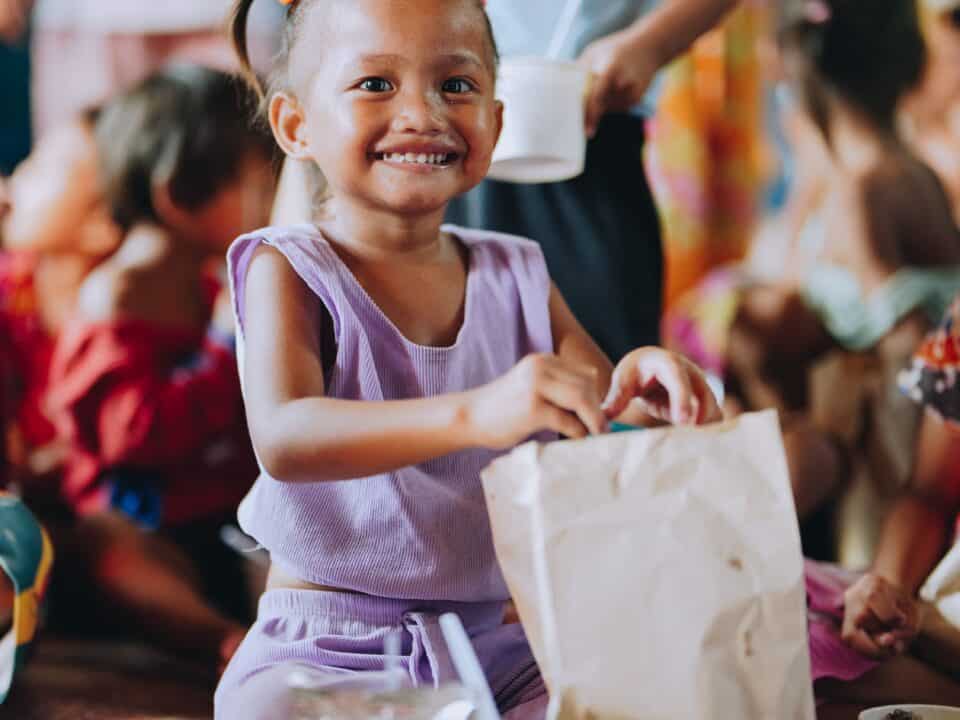A child receives a hot meal in the Philippines