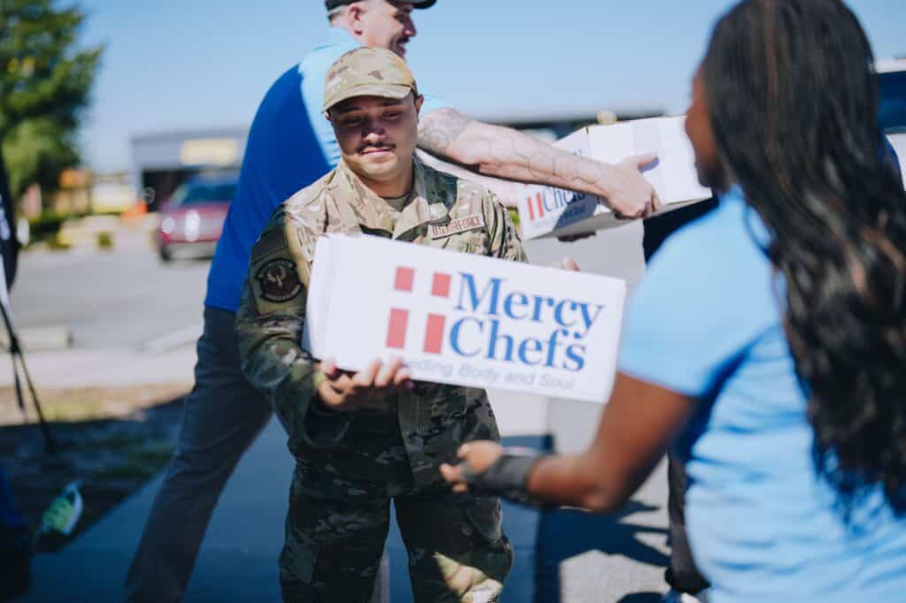 A service member receives a Family Grocery Box in Florida
