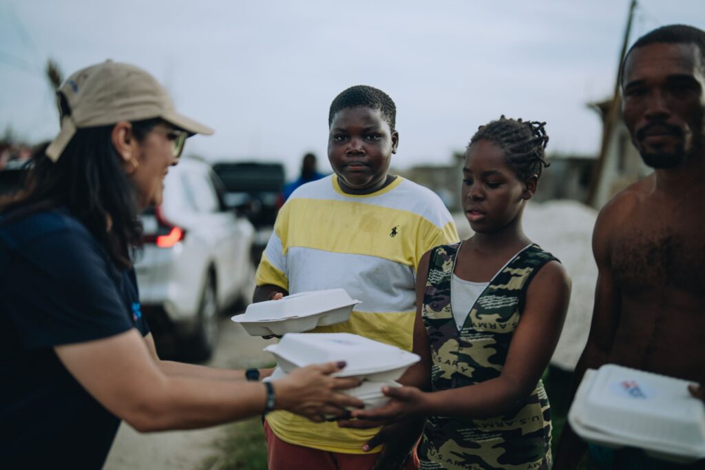 A family receives Mercy Chefs hot meals in Jamaica