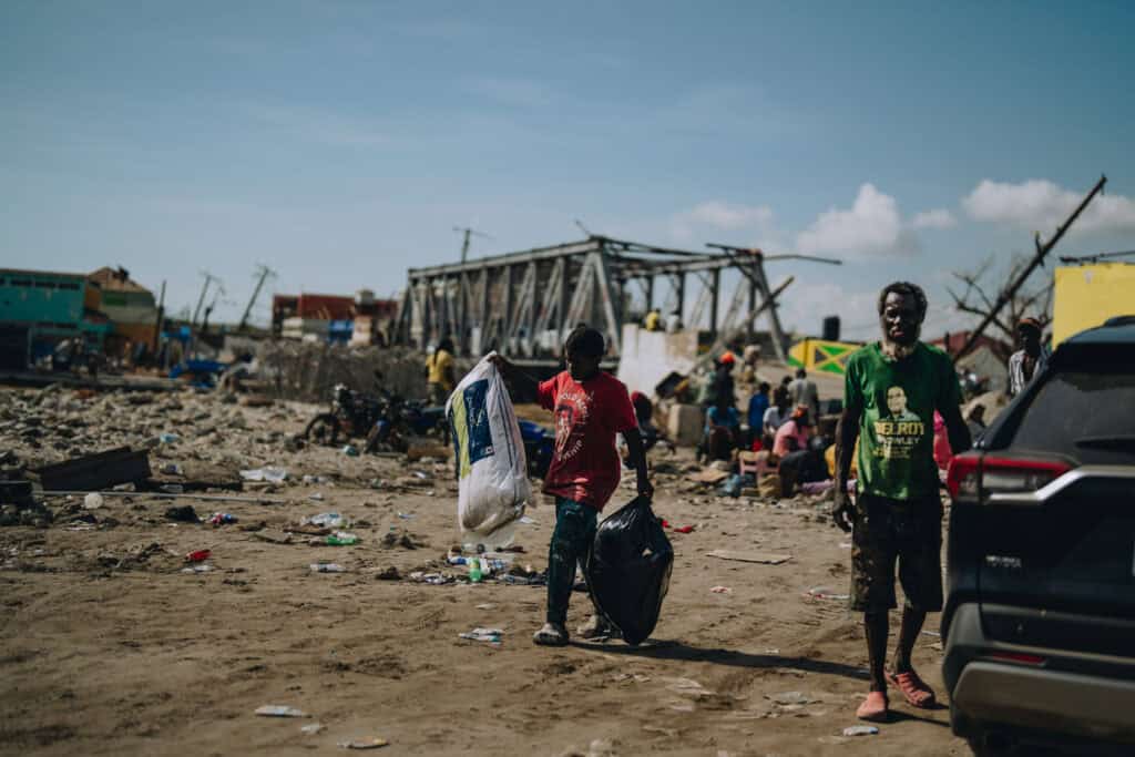 Families sift through the wreckage in the aftermath of Hurricane Melissa