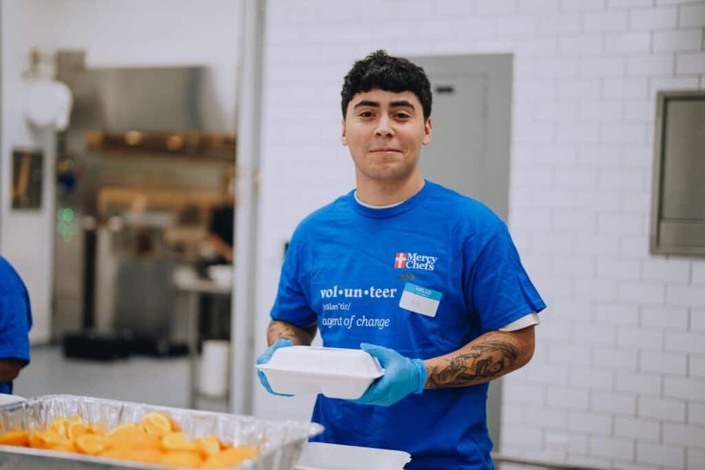 A Mercy Chefs volunteer plates meals in Oahu, HI