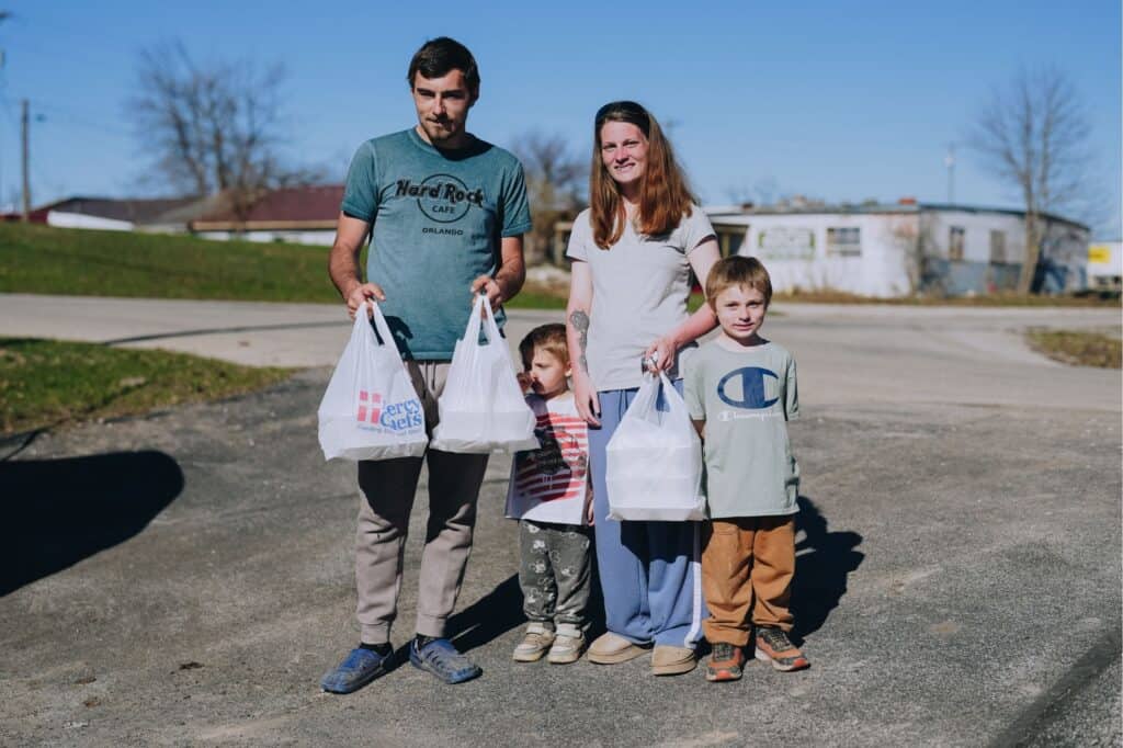 A family of four receives hot meals in Onaway, MI