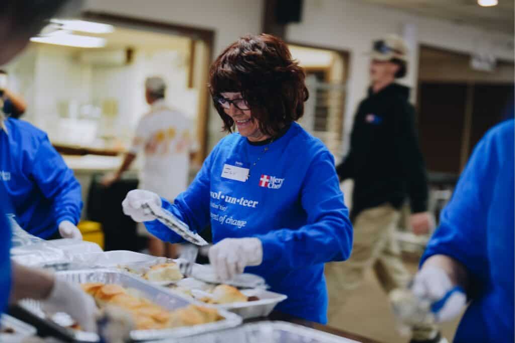 A Mercy Chefs volunteer plates meals in Michigan