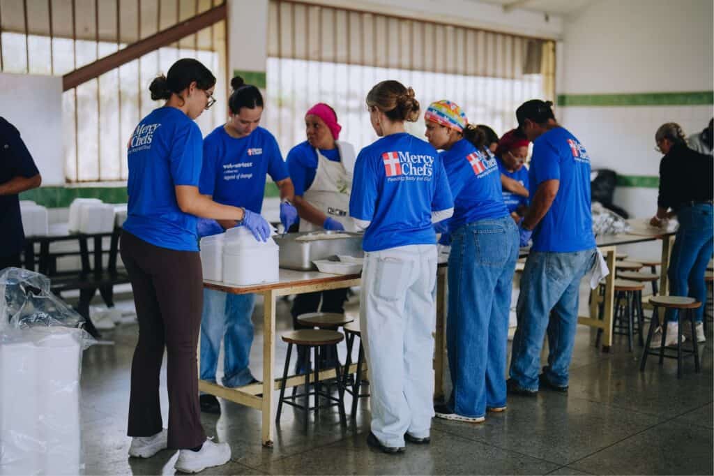 Volunteers prepare meals in Venezuela
