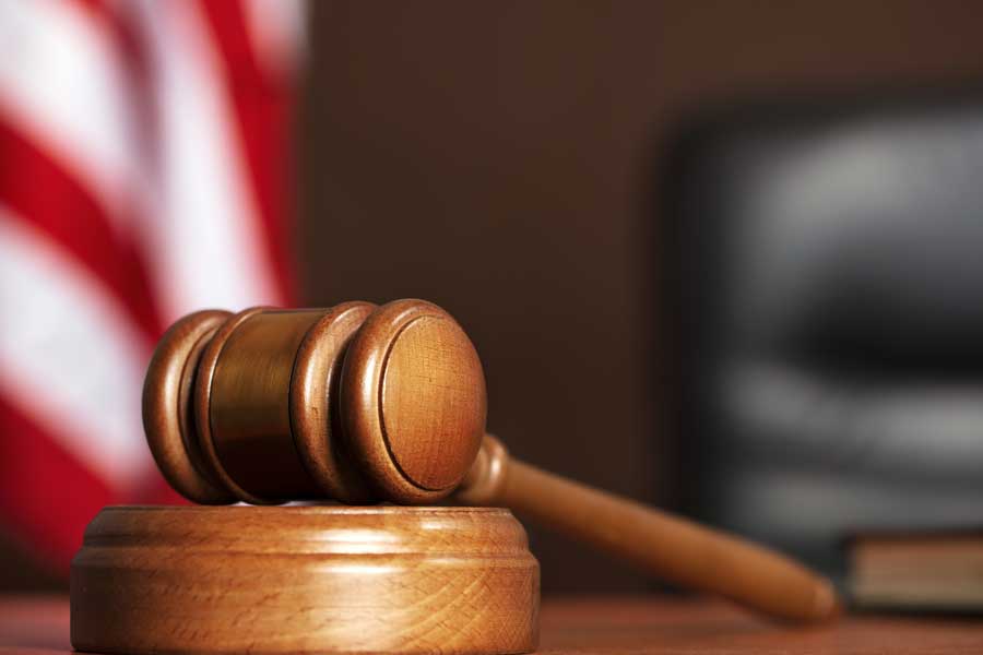 Gavel and sound block used in legal proceedings, symbolizing justice and authority in the courtroom.