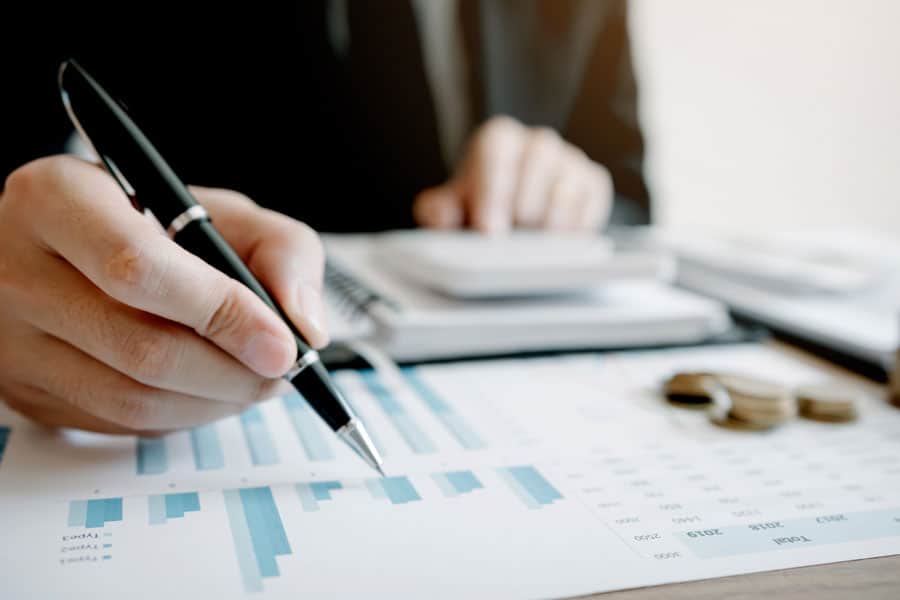 Financial analysis and data review at MHP office.