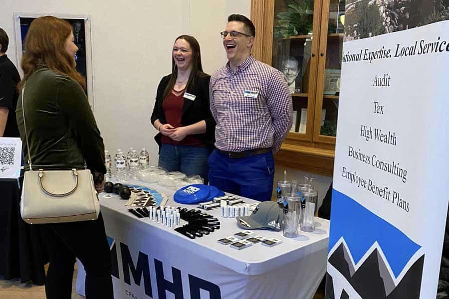 MHP representatives engaging with attendees at a community outreach event.