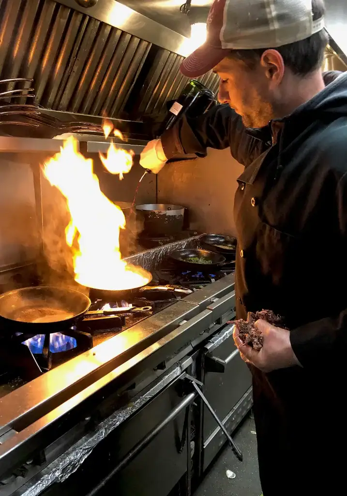 Michael's Harborside staff member cooking in the kitchen
