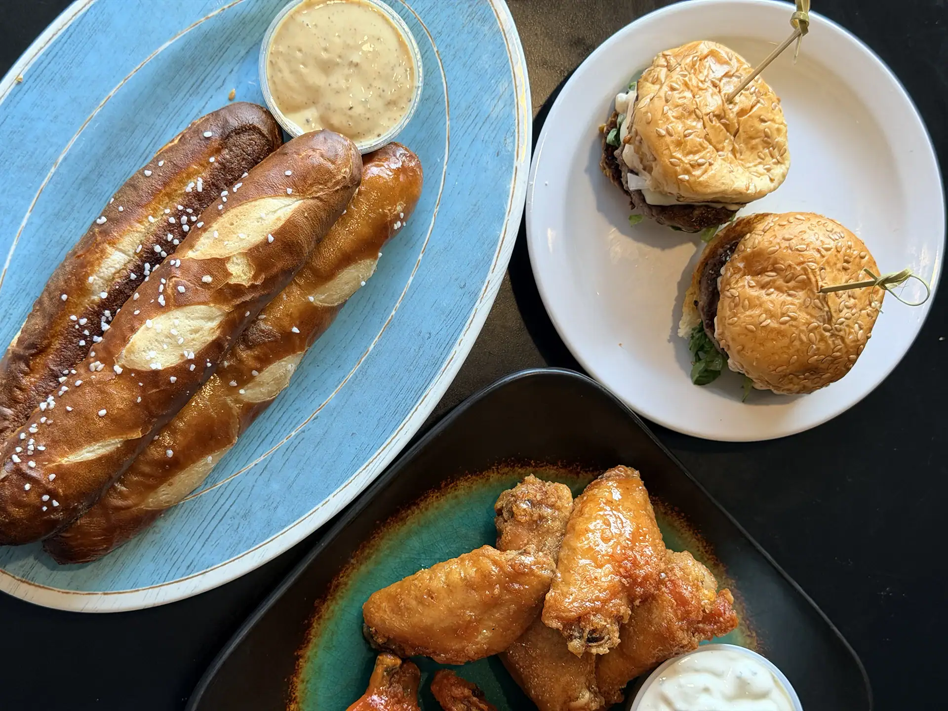 Hot dogs, sliders, and chicken wings served at Michael's Harborside.
