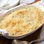 Creamy baked pasta casserole with a crunchy breadcrumb topping and melted cheese, served in an oval ceramic dish. Perfect comfort food recipe for sharing.