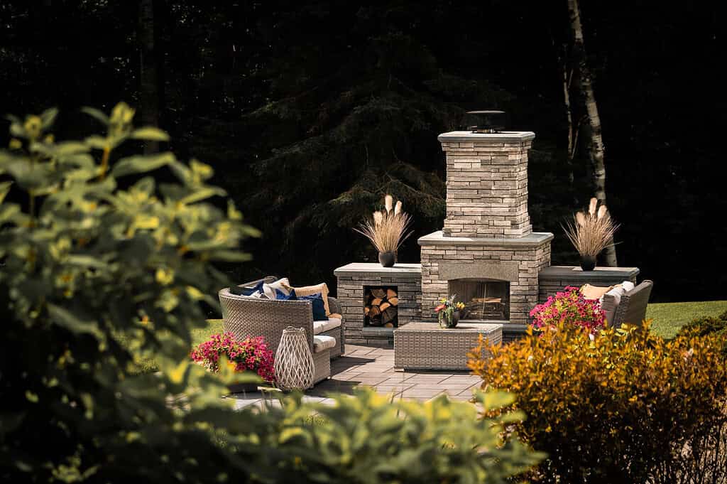 Cozy outdoor fireplace with seating, perfect for backyard entertaining.