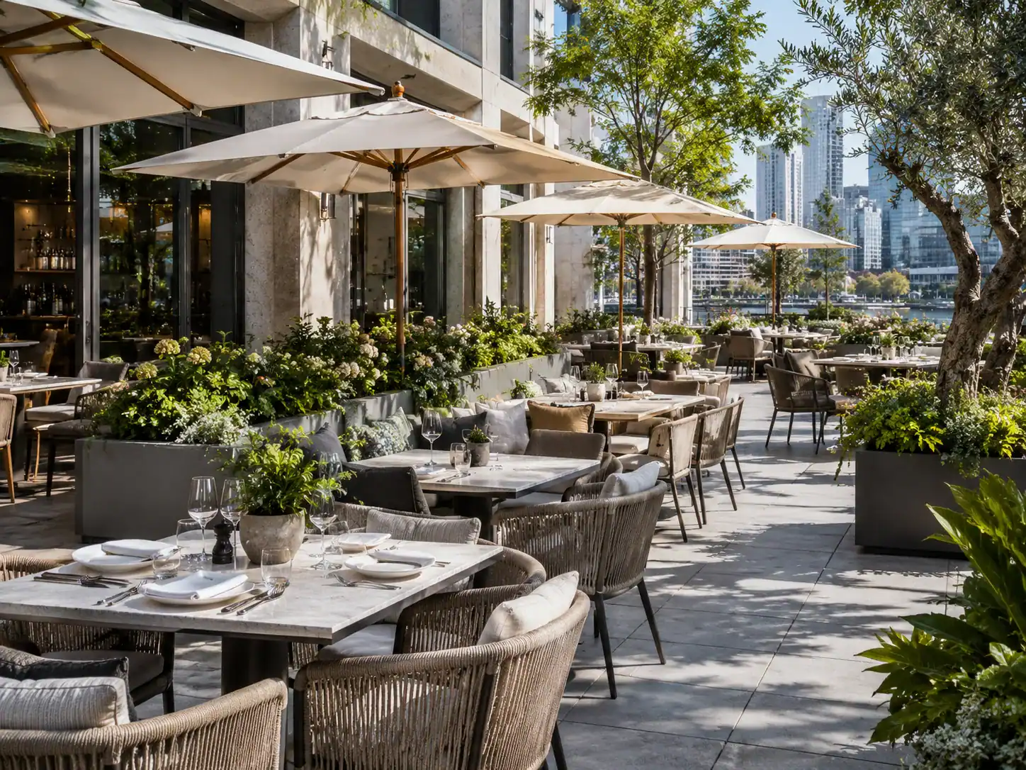 Commercial restaurant terrace with outdoor dining furniture and umbrellas