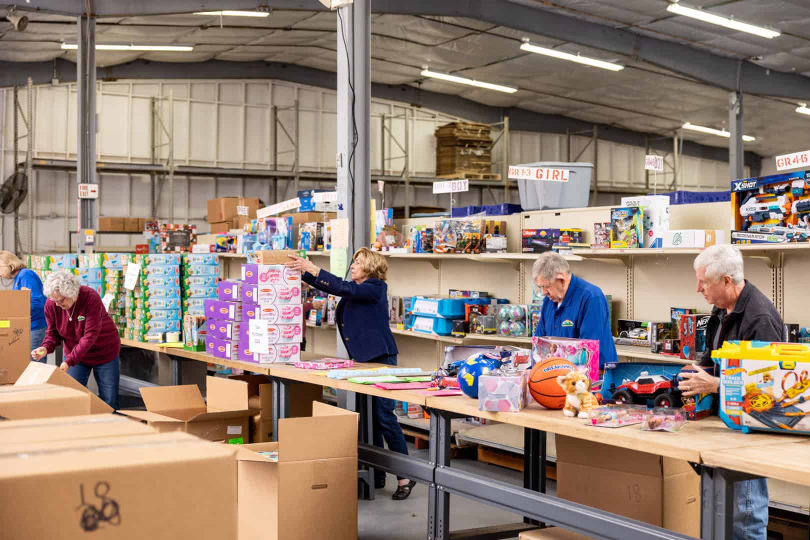 A group of people in a warehouse.